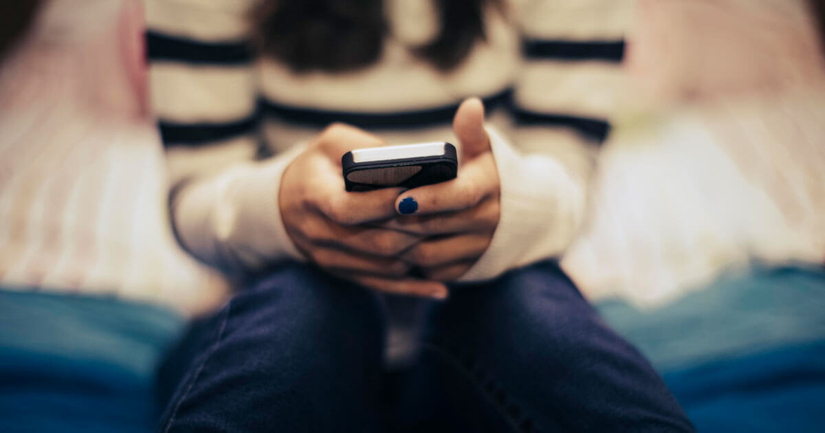 Feature image Close up of teenage girl in bedroom using smart phone