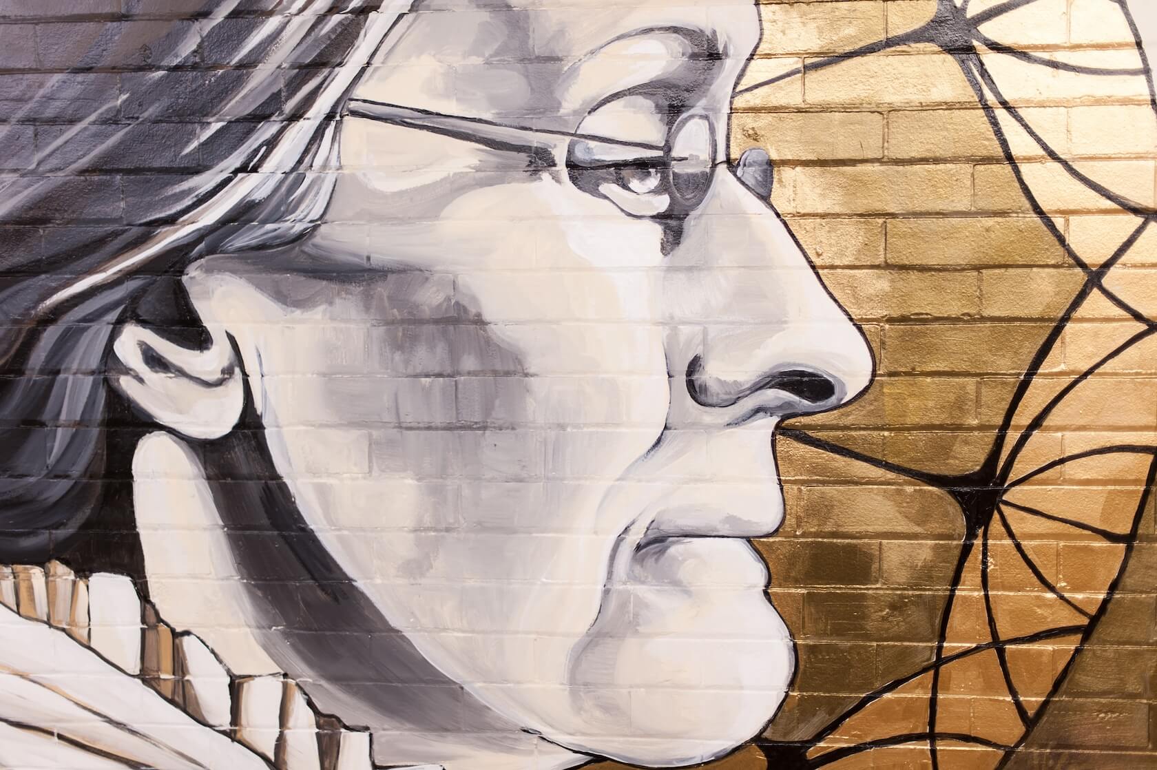 Rochester artist Sarah Rutherford paints a mural featuring Susan B Anthony on a tunnel wall under Dewey Hall March 30, 2015. // photo by J. Adam Fenster / University of Rochester