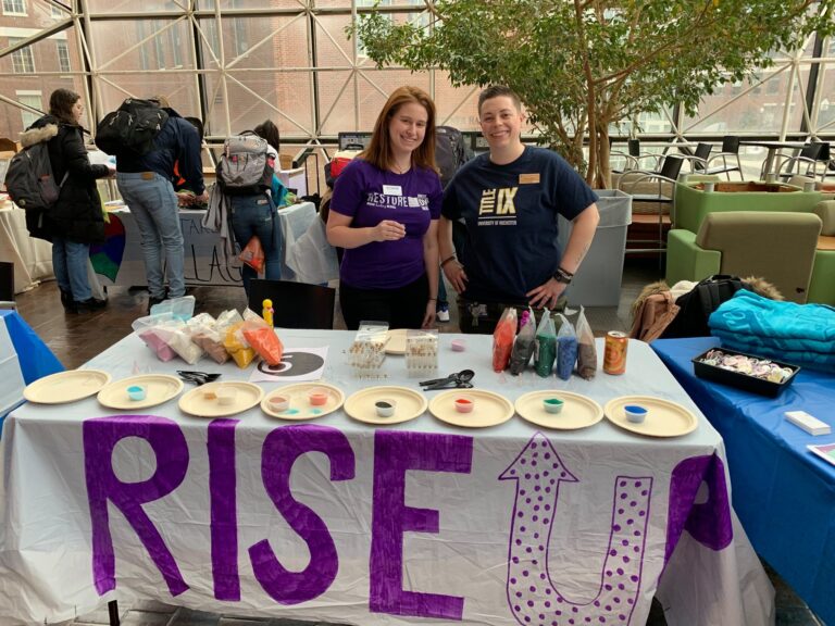 Employees tabling at the Rise Up fair