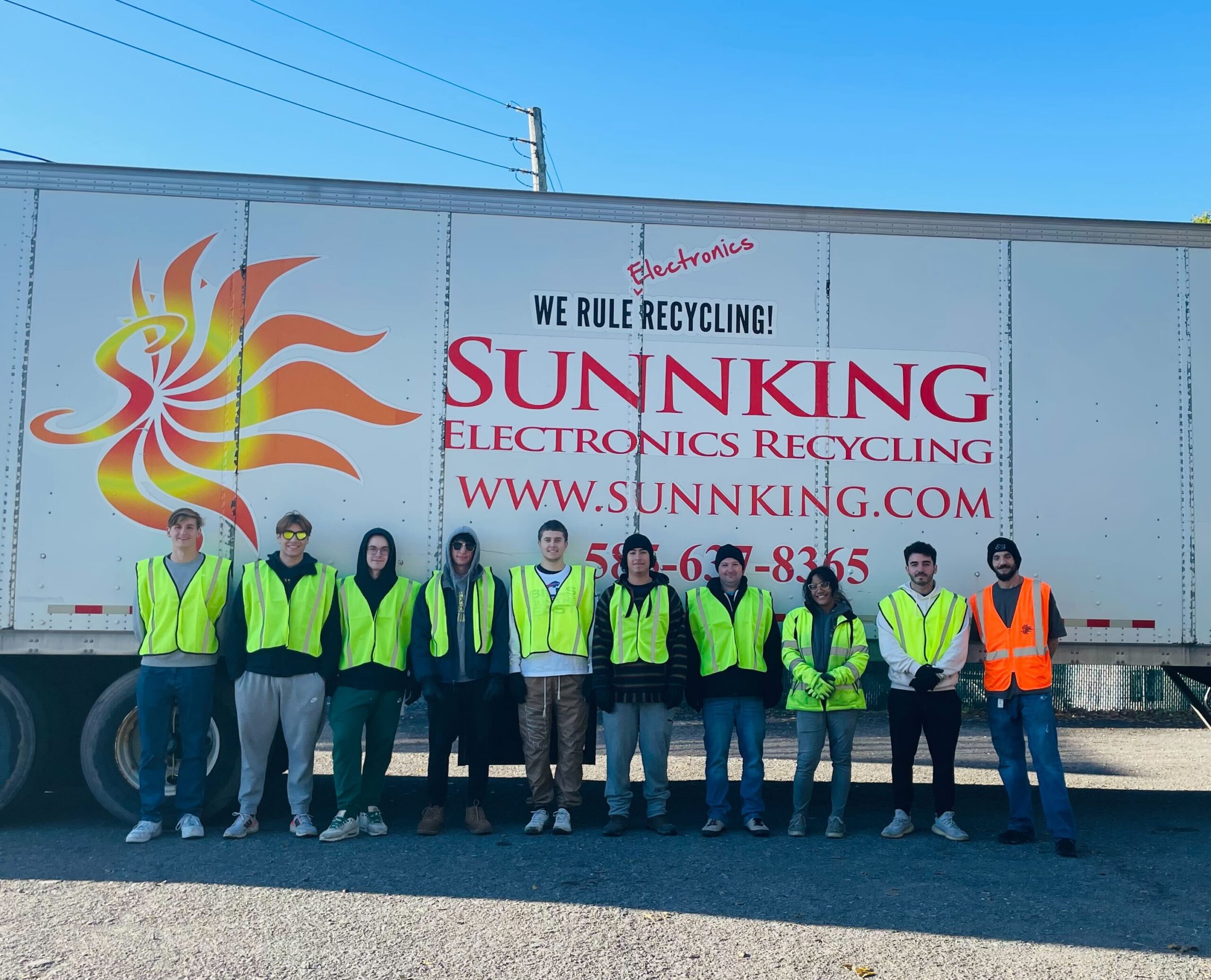 Volunteers pose with Sunnking and truck during the annual E-Cycle Day event.