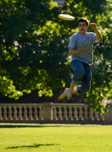 Student playing frisbee
