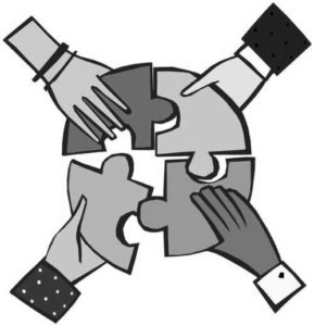 hands putting puzzle pieces together