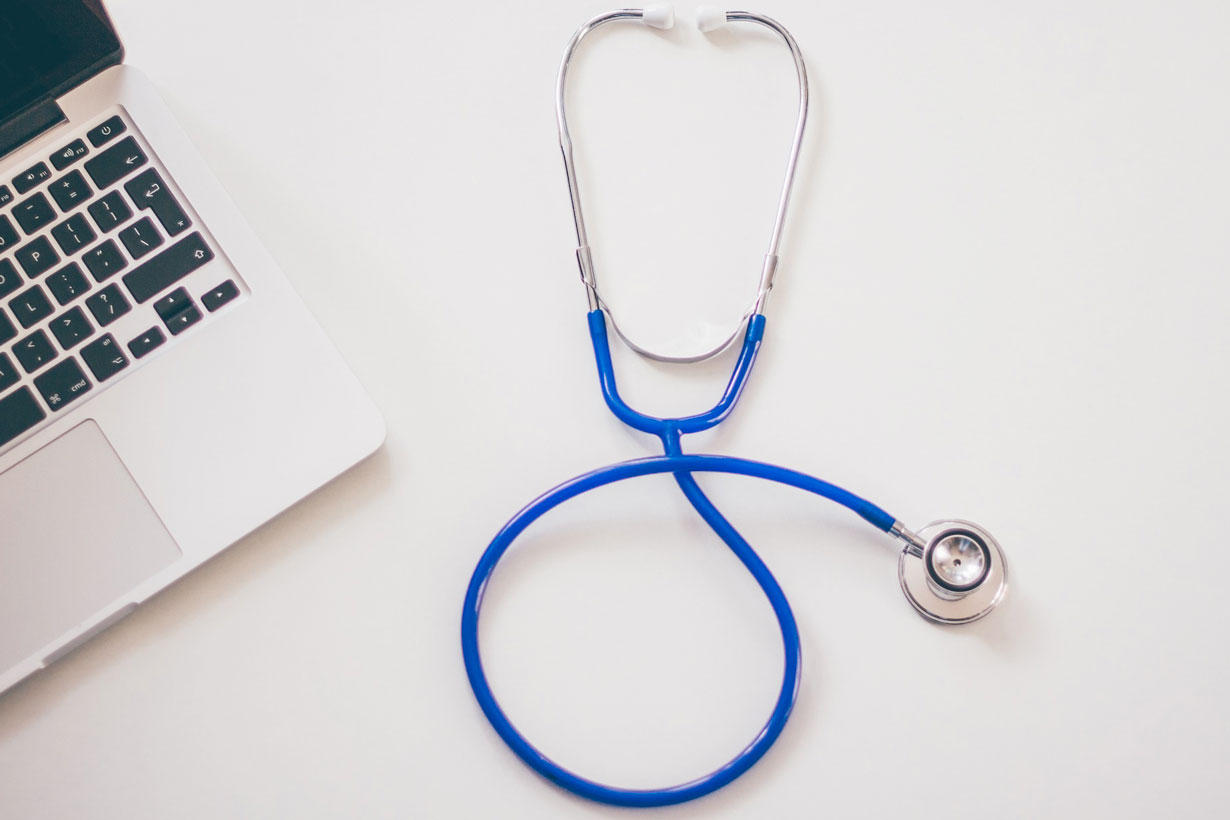 Blue stethoscope on a desk