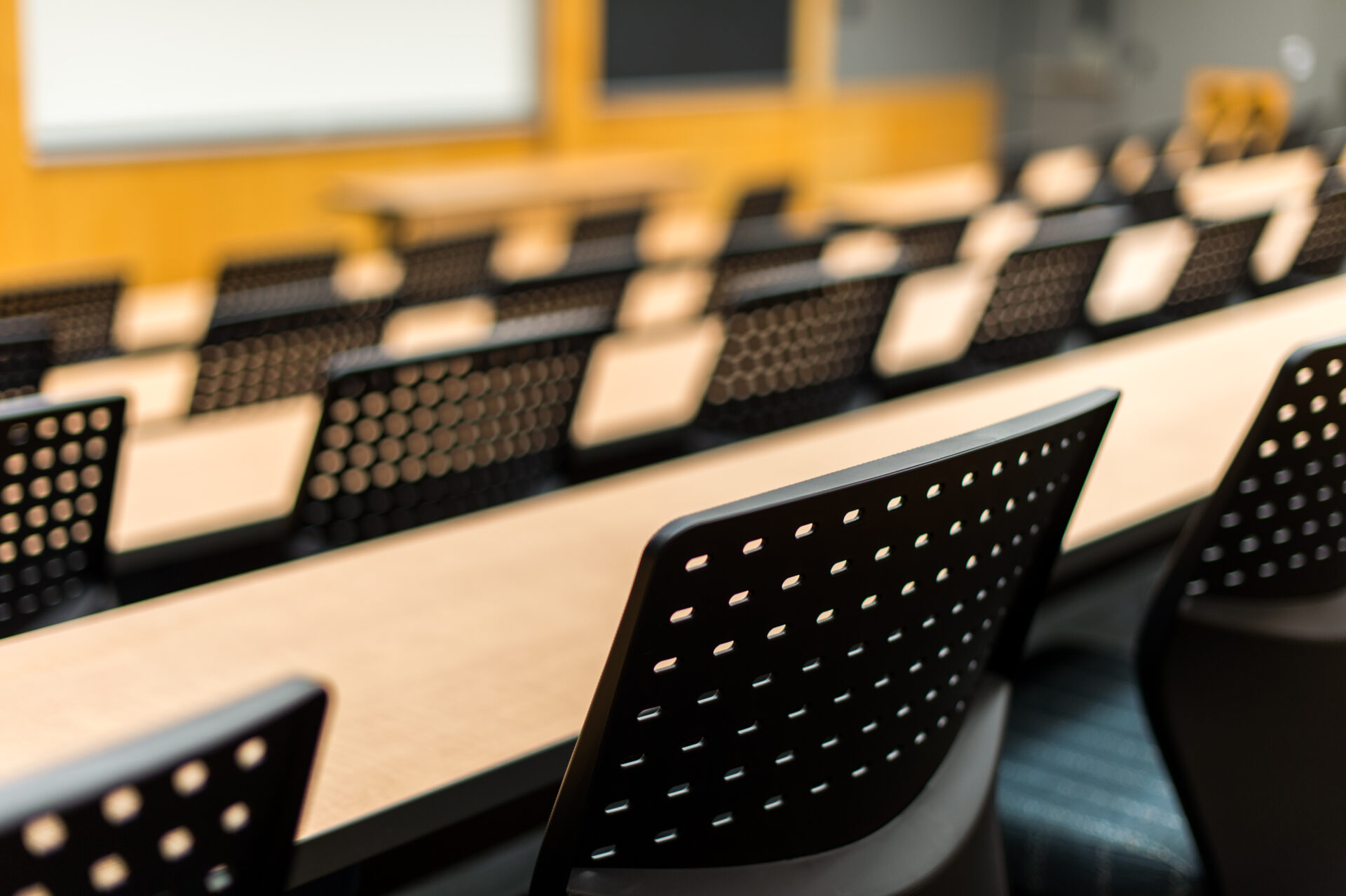 Rows of chairs and tables in University of Rochester's Meliora Hall