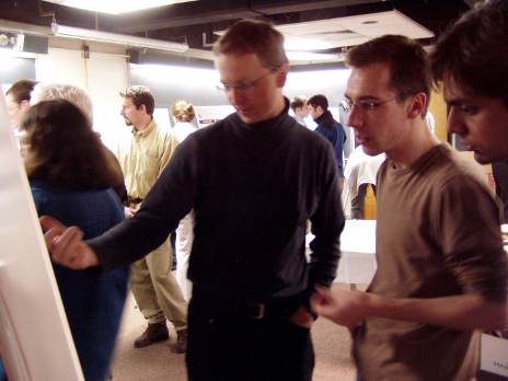 Students at a poster presentation.