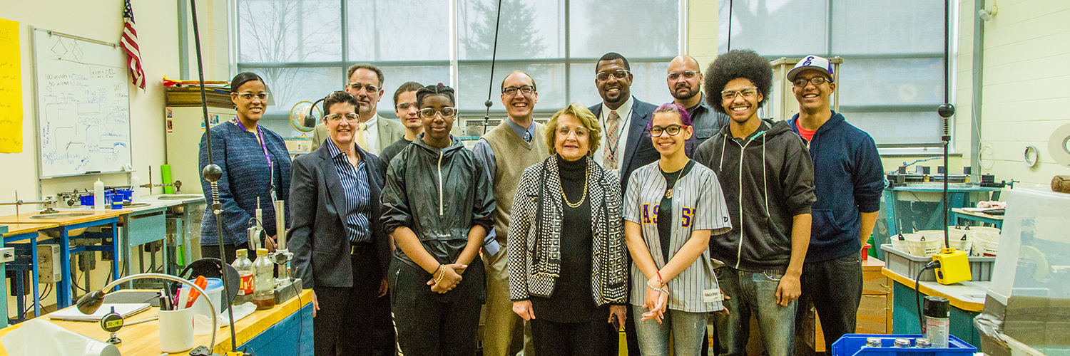 Congresswomen Louise Slaughter with staff and students in the Optics Lab