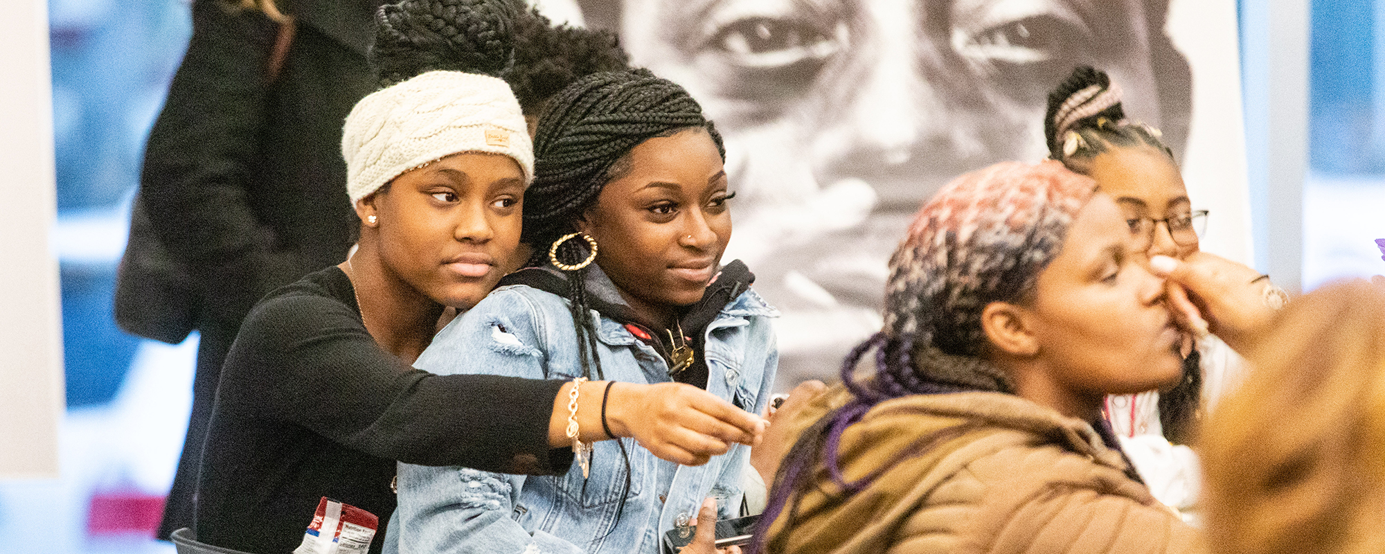 Young women watching a presentation