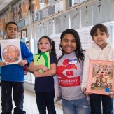 students with their artwork