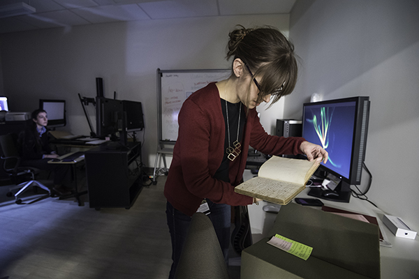 woman digitizing document in a lab