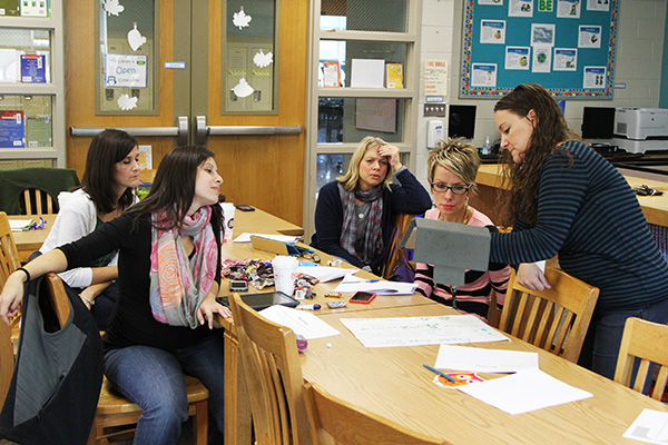 teachers working together around a table