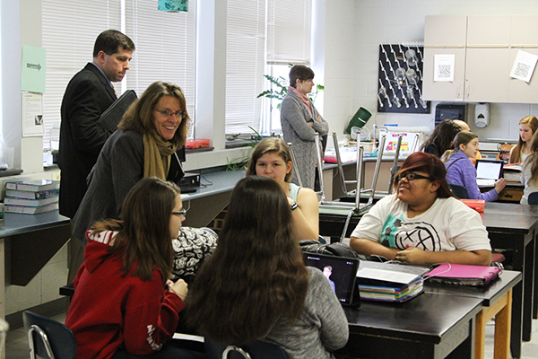 teacher interacting with students