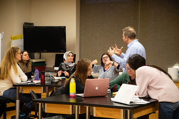 Meuwissen Teaching112 professor working with students in classroom