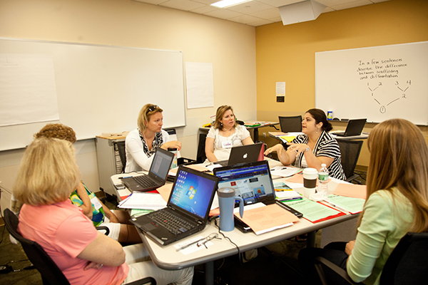 Warner Center CELLS workshop 2013 educators talking around a table